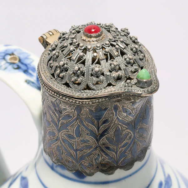 A 17th century Arita ware blue and white porcelain ewer with 19th century Ottoman silver and gem set mounts. - image 3