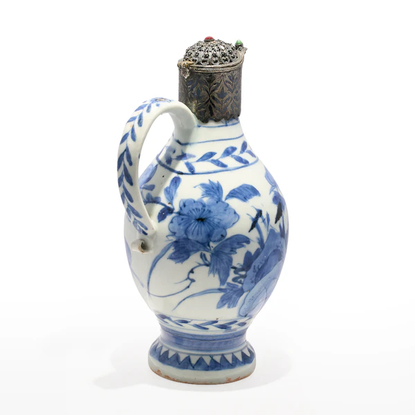 A 17th century Arita ware blue and white porcelain ewer with 19th century Ottoman silver and gem set mounts. - image 2