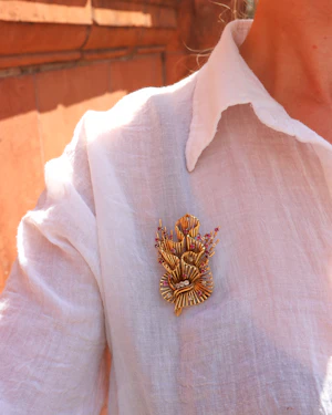 Floral ruby gold brooch