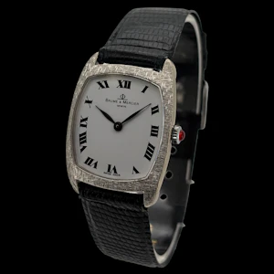 BAUME ET MERCIER CUSHION 18KT WHITE GOLD FLORENTINE FINISH WHITE ROMAN NUMERALS WITH BOX AND PAPERS 1978