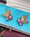 A very fine pair of 18ct Yellow & White Gold (tested), Retro, Clip Earrings,  a Stylised Foliate Design set throughout with Diamonds, Burma Rubies & Sapphires. Circa 1940 - image 4