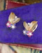 A very fine pair of 18ct Yellow & White Gold (tested), Retro, Clip Earrings,  a Stylised Foliate Design set throughout with Diamonds, Burma Rubies & Sapphires. Circa 1940 - image 1