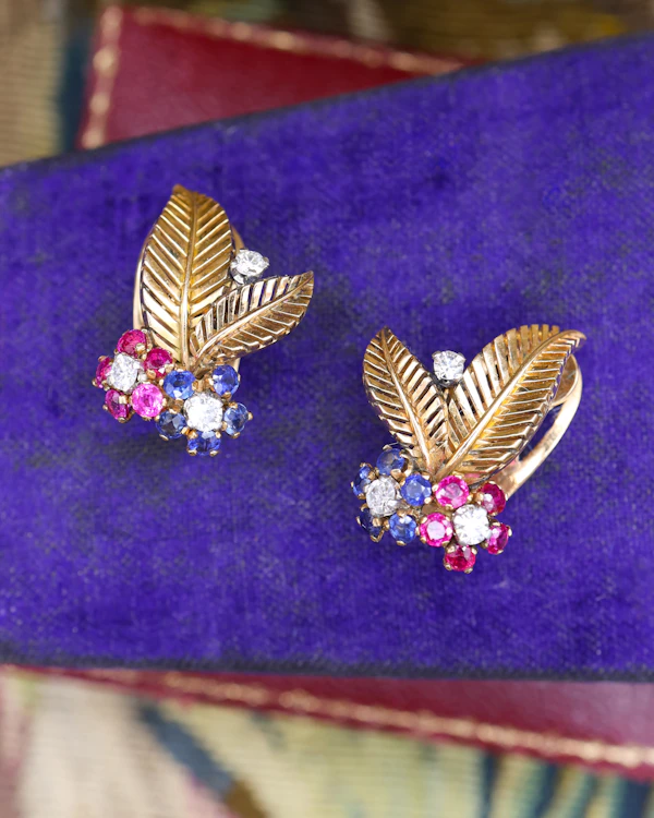 A very fine pair of 18ct Yellow & White Gold (tested), Retro, Clip Earrings,  a Stylised Foliate Design set throughout with Diamonds, Burma Rubies & Sapphires. Circa 1940 - image 1