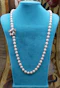 A fine Yellow Gold & Strung Cultured Pearl Necklace, set with four Round Cut Natural Sapphires (0.40 carats) and eighty three Oval and Near Shaped Cultured Pearls. Circa 1960 - image 1