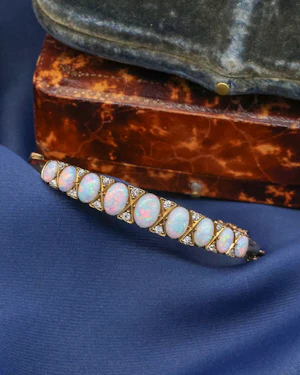 Downstairs at Grays, a very fine Graduated Antique Opal and Diamond Bangle set in 15ct Yellow Gold, English, Circa 1905