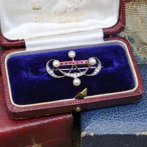 Downstairs at Grays: A very fine Victorian Pearl, Ruby and Diamond Brooch set in Silver tipped, High Carat Gold (tested), Circa 1880.