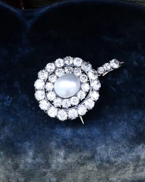 A very fine example of a Natural Pteriidae Oval Pearl and Diamond Pendant - Brooch. Victorian Circa 1890