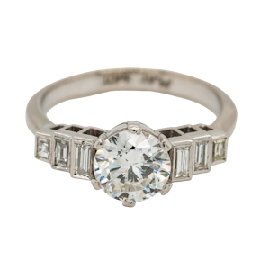 Diamond  solitaire ring with extended baguette diamond  shoulders