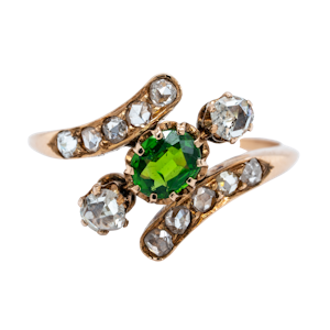 Demantoid green garnet and  diamond crossover ring.