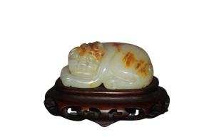 A Chinese jade carving of a lion dog.