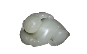 A Chinese jade carving of a boy.