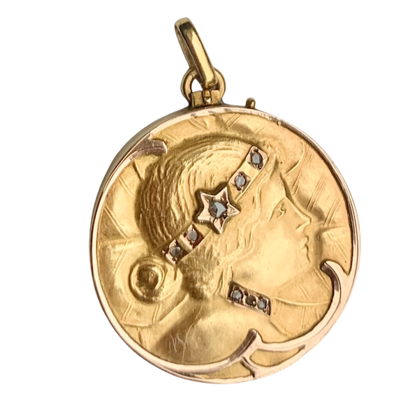 An Art Nouveau Gold and Diamond Repousse Locket - image 1