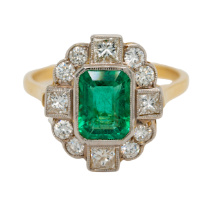 Emerald and diamond oval cluster ring