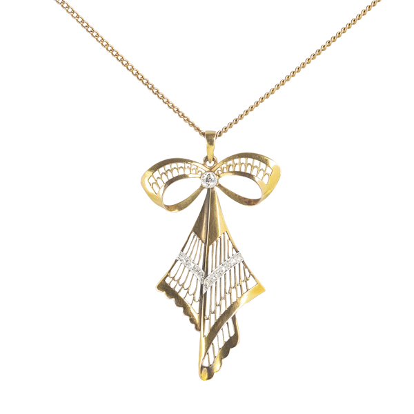 A Diamond and Gold Bow Necklace - image 1