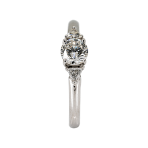 Diamond solitaire ring with triangular diamond shoulders