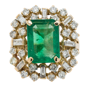 Large emerald and diamond cluster ring
