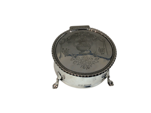 A silver jewellery box on feet