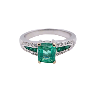 Emerald and diamond ring with emerald inserts shoulders