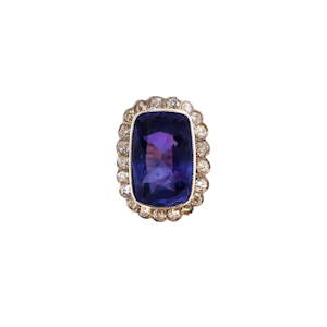 Sapphire of exceptional size and quality and diamond cluster ring. Sapphire of some 16.50 cts. and  certificated. Natural colour change.
