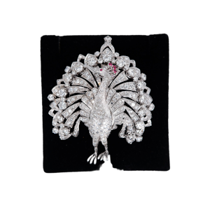 Diamond set large peacock brooch with ruby crest set in platinum