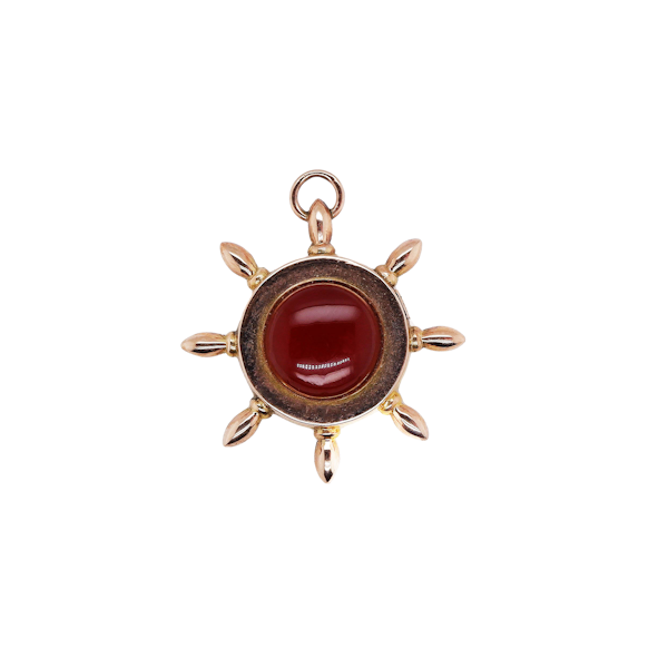 Vintage 9 ct. gold carnelian and blue enamel fob in the shape of a nautical  steering wheel - image 1