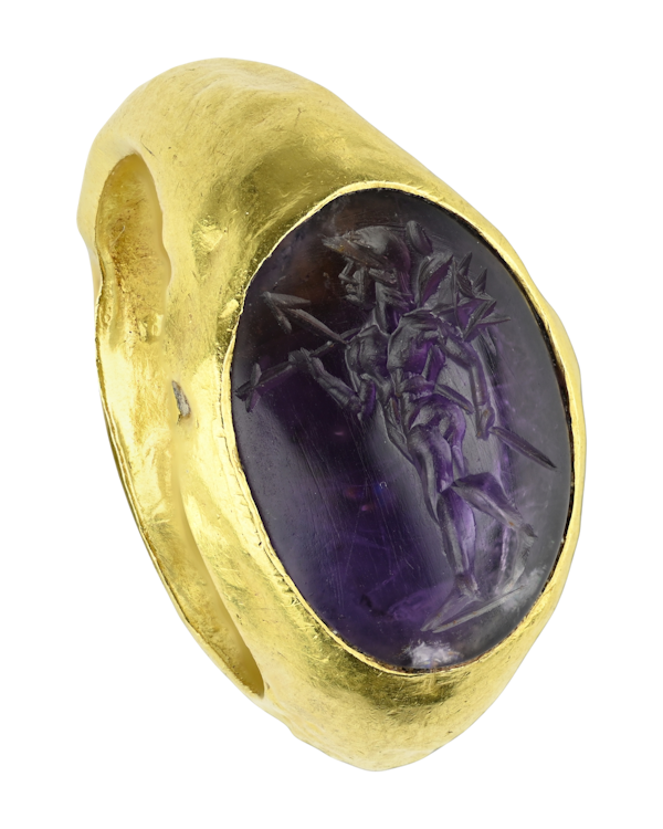 An ancient gold ring set with an amethyst intaglio of Mars Gradivus.  Roman, 2nd century A.D. - image 1