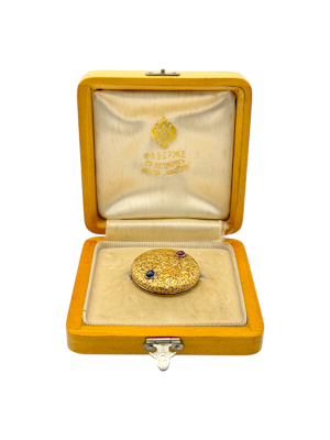 Russian gold brooch designed in samarodok style with sapphire and ruby cabochon, St Petersburg, c.1900.