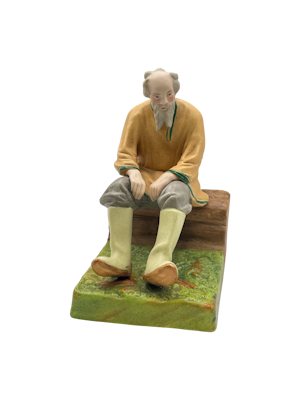 Russian porcelain figure of an old man sitting by Dimetrov Factory after famous gardener producer, c1930s.