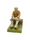 Russian porcelain figure of an old man sitting by Dimetrov Factory after famous gardener producer, c1930s. - image 1