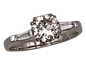 Diamond solitaire ring with diamond baguettes shoulders