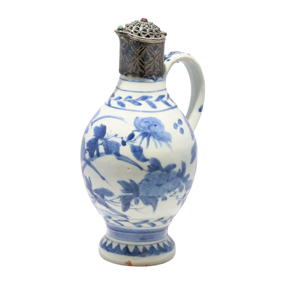 A 17th century Arita ware blue and white porcelain ewer with 19th century Ottoman silver and gem set mounts. - image 1